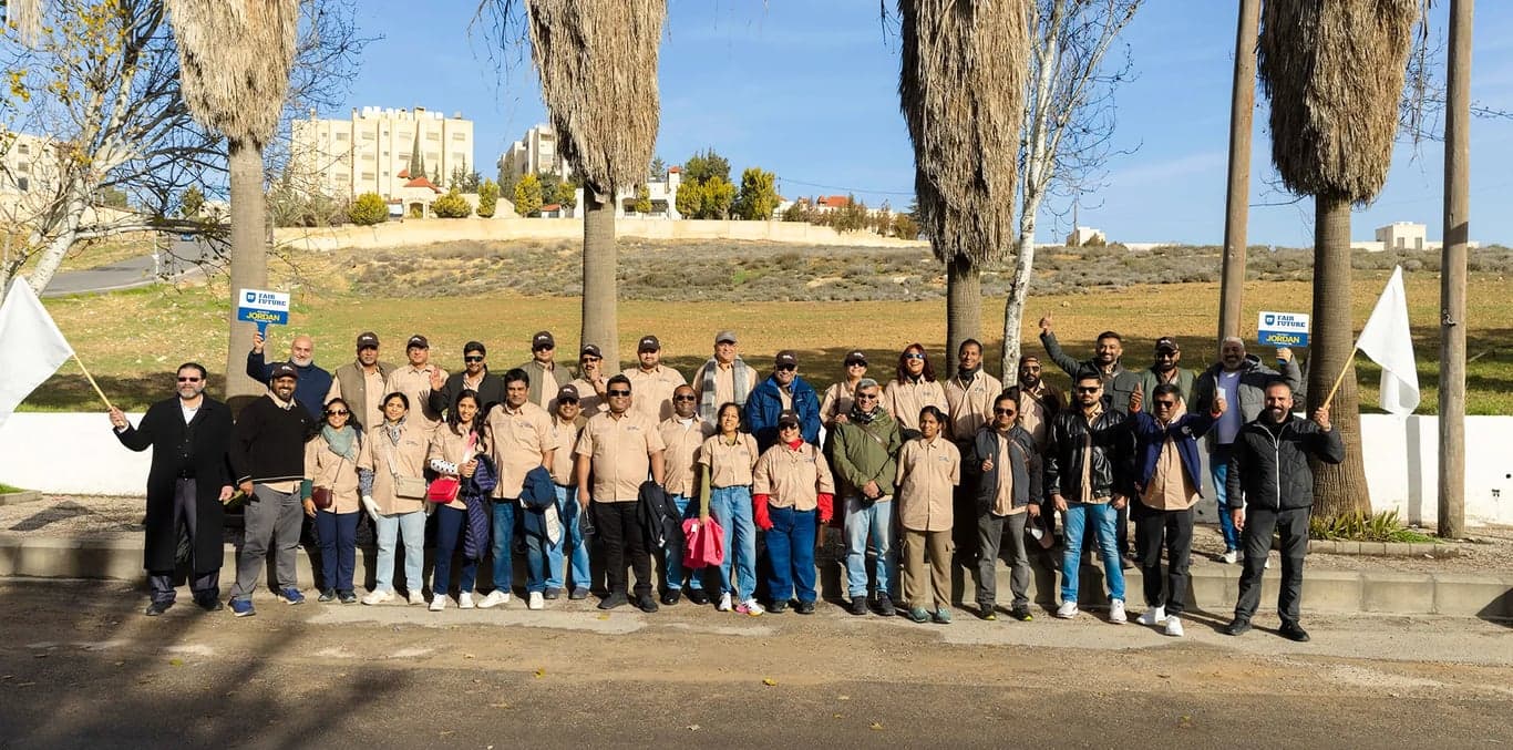 Convoy of vehicles exploring rugged mountain terrain