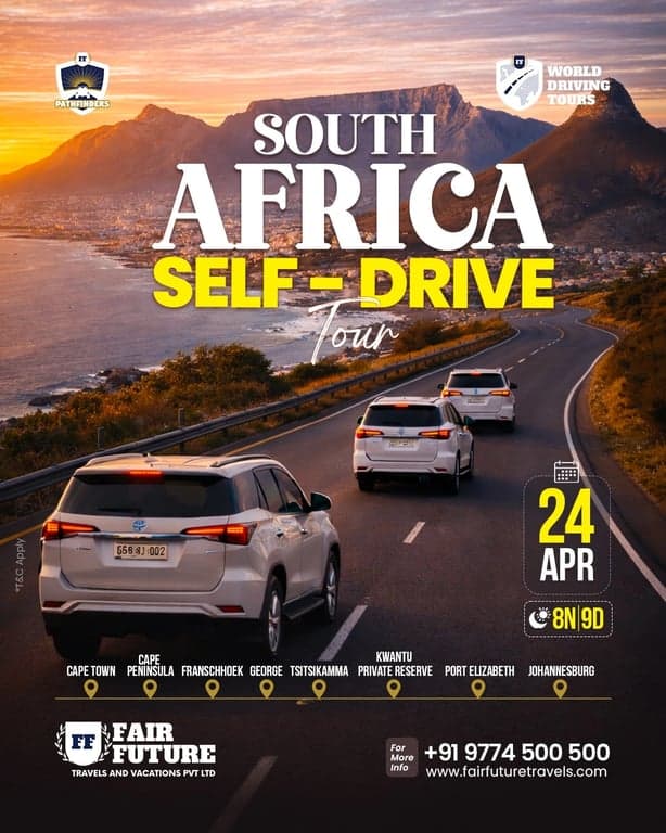 A convoy of vehicles on a scenic coastal road in South Africa.